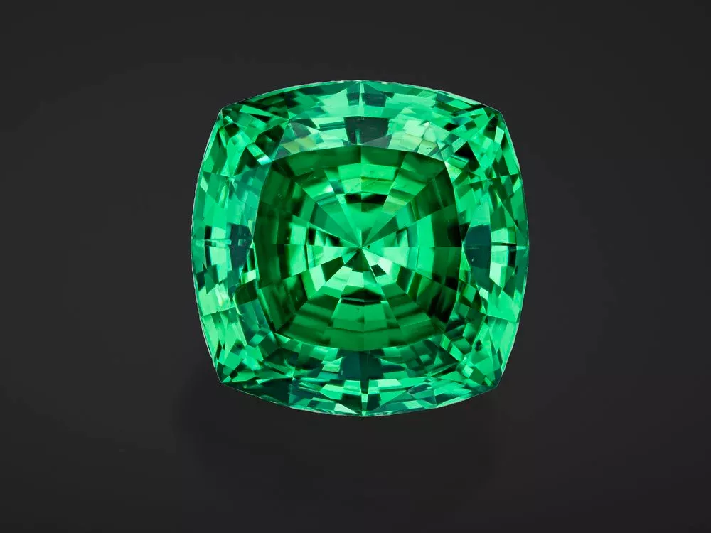 lion of merlani bright vivid green gemstone on black background