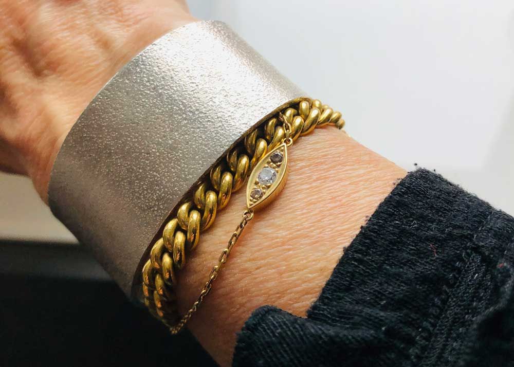 A group of bracelets nicely layered on a wrist